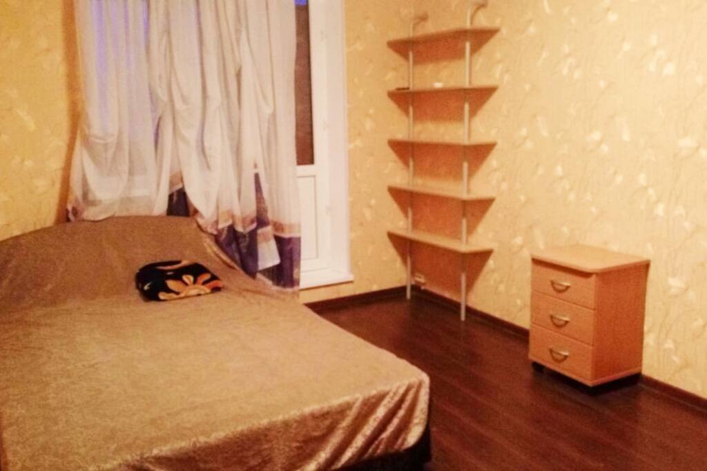 This is bedroom number 3 with a balcony lying behind that white door.