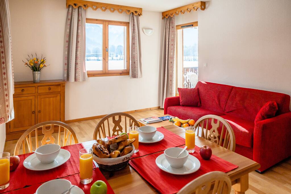The living area is bright and spacious, perfect for relaxing after a wonderful day.
