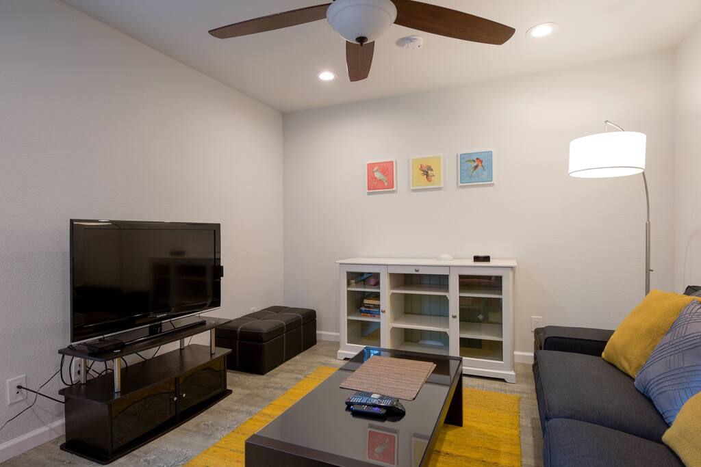 Living room with cable TV + roku and work desk