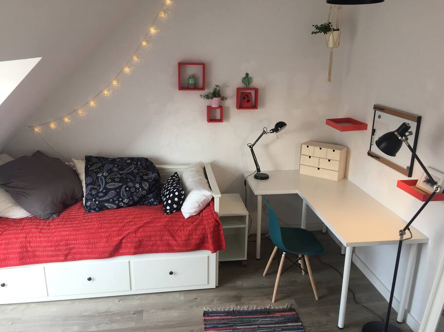 Quirky cozy room with lots of light day or night, a workspace, a comfy bed for 1 or 2, and a huge mirror.