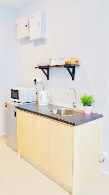 Kitchenette with microwave, fridge and kettle