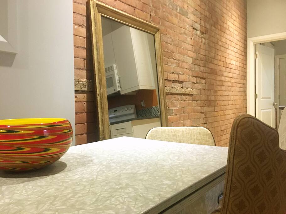 Comfortable furniture, unique, handmade touches and beautifully refinished elements make the home inviting and easy to relax in after a long day of work or site seeing