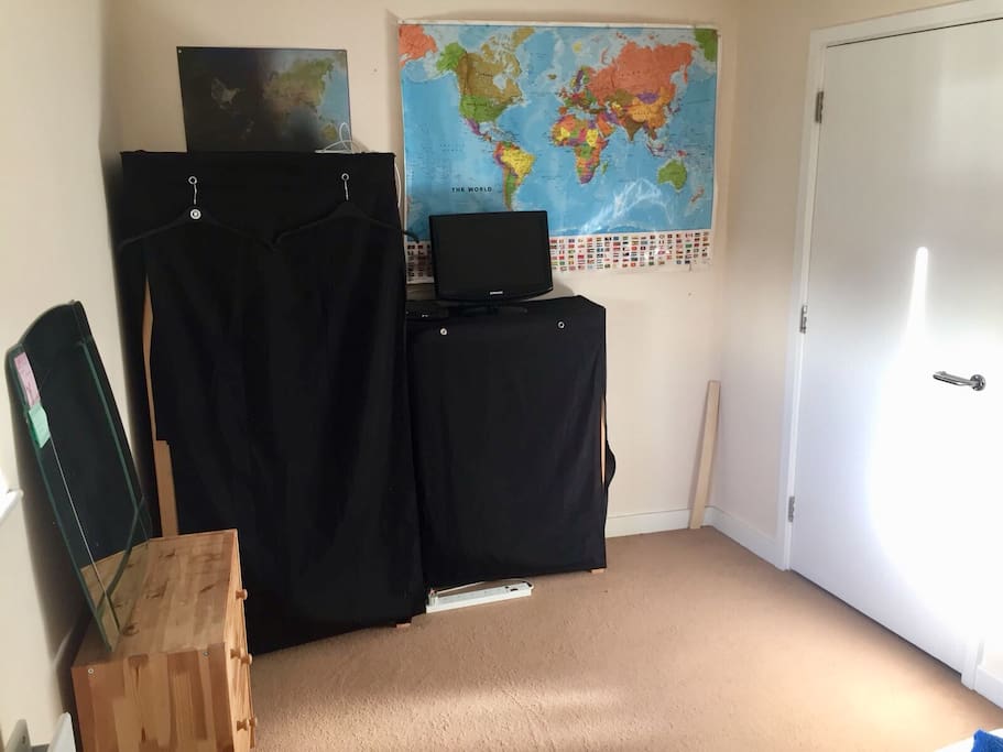 Long view of room with wardrobe and drawers available for use