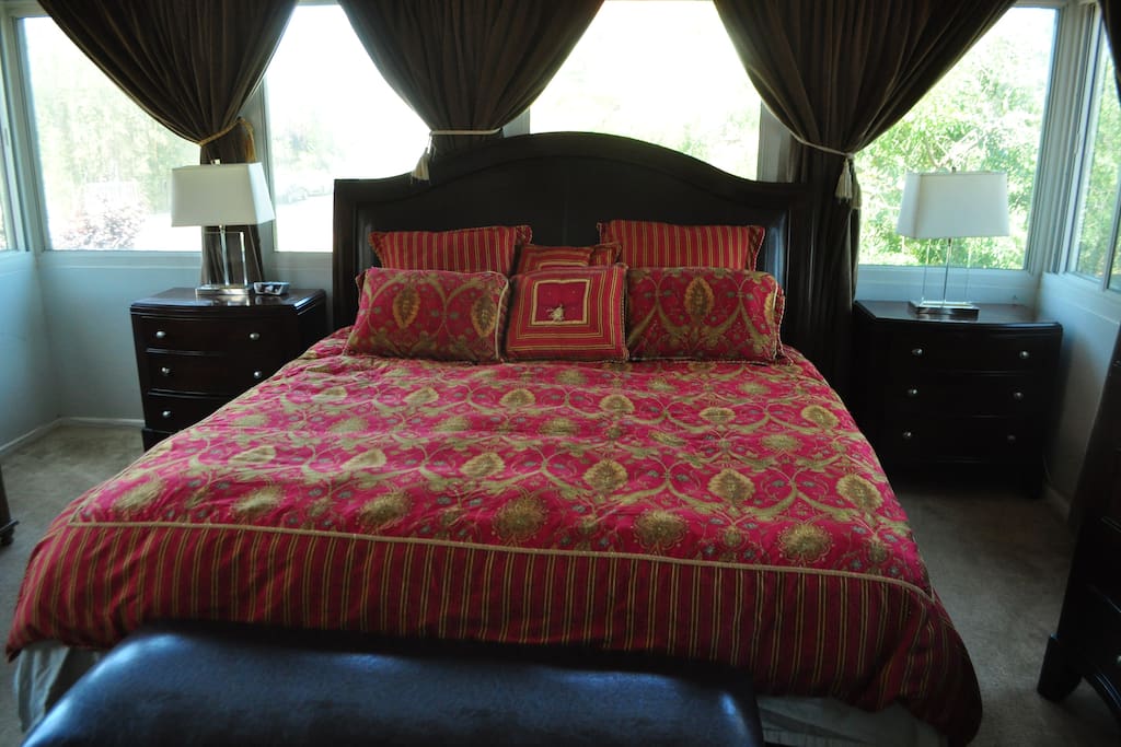 Master bedroom with wrap-around windows/views.