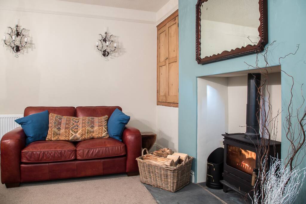 Snuggle up on the sofa in our cosy TV room, complete with wood burner