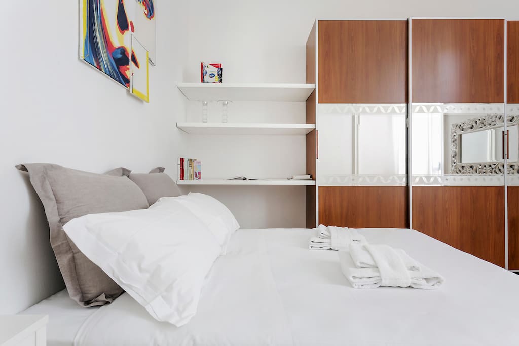 The bedroom & the spacious wardrobe