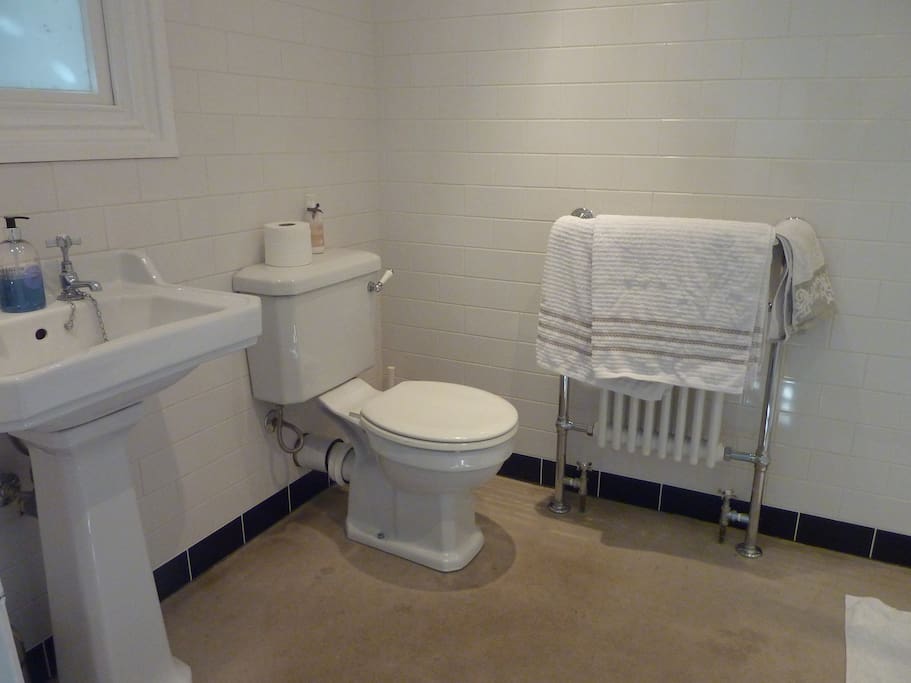 Fresh white towels, newly fitted bathroom