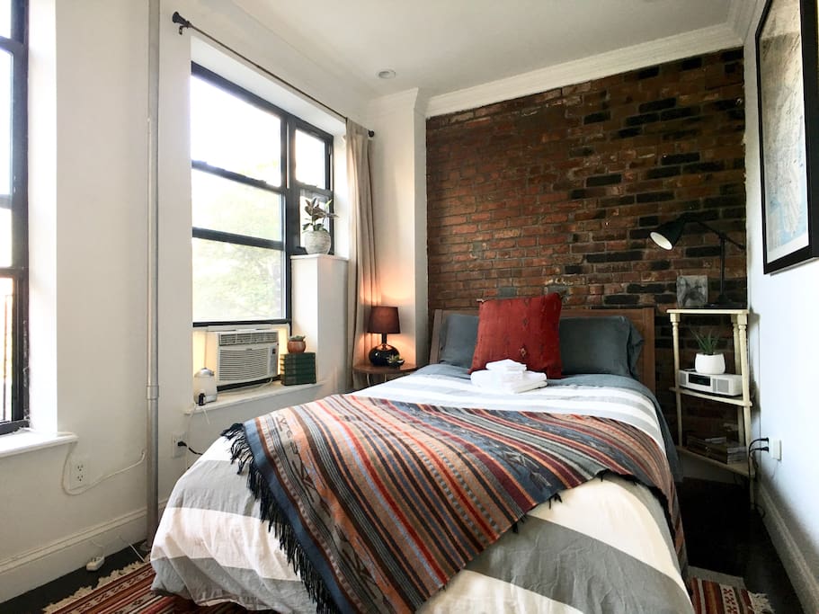 Two large windows with a nice view of the middle of the block. A nice quiet room for your getaway.