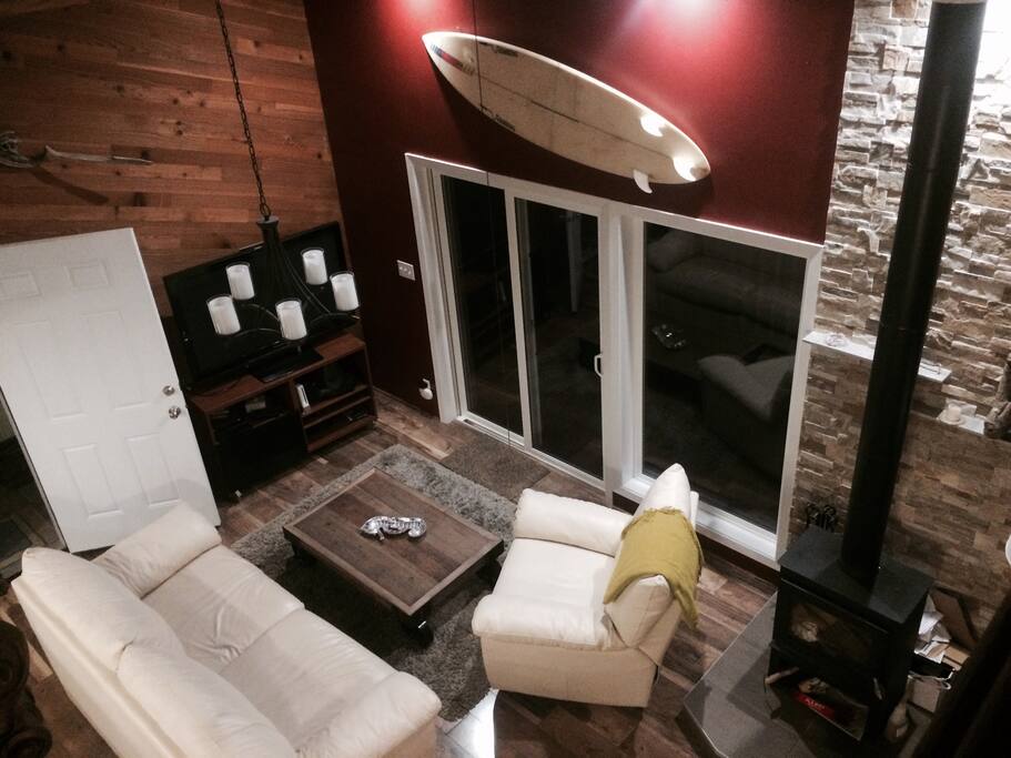 View from loft over living area. Large flat screen TV
