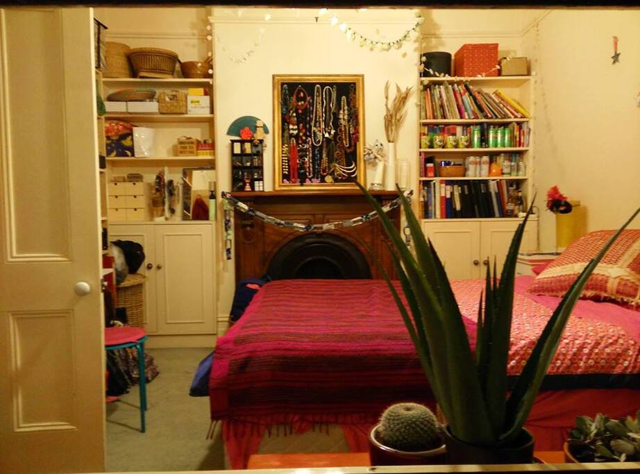 Bedroom with fireplace & queen bed