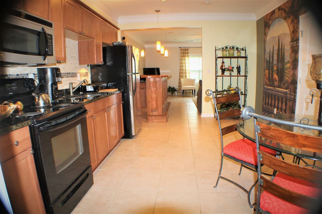 Full kitchen with dining area. Everything you need if you are planning a long stay!