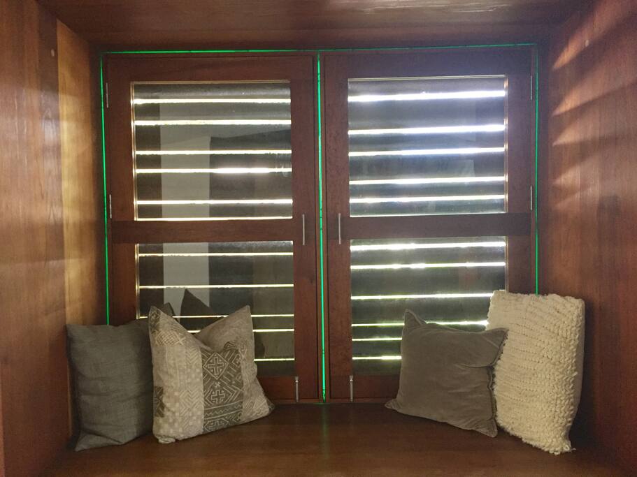 Custom built window seat that overlooks the backyard and garden patio.