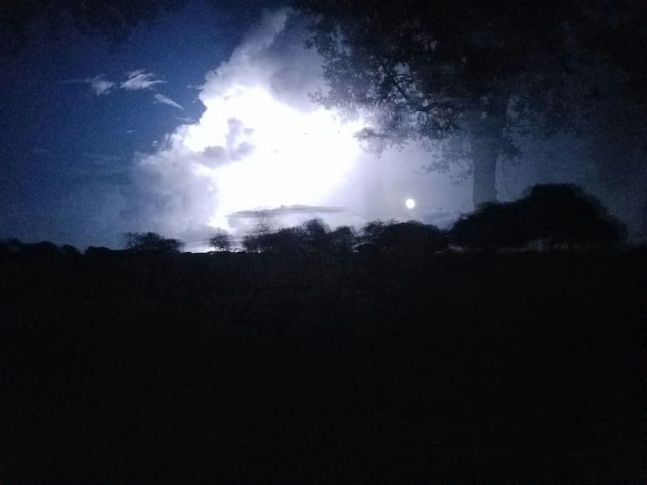Lightening lights up the night sky. Riders in the sky.