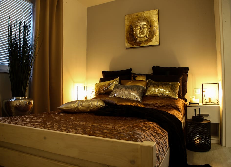 Located 1,5 km away from city centre, The Lie Design apartments surely are your home away from home. One bedroom apartment and three studios in a recently renovated building, just 50 m away from famous Ljubljana church, called Trnovska cerkev, make a perfect stay for couples, families or friends, travelling together.
Our non-smoking one bedroom apartment, called the Golden Temple, designed with earthy tones and a soft touch of golden details, measures 48 m2 and is a perfect relaxing oasis in the heart of vivid city of Ljubljana.
It features one bedroom and living room with a sofa. Suited for 4 guests, this ground-floor offers a beautiful private garden in front of the apartment with a nice sitting area.
It includes a well-equipped kitchen with a dining area, a private bathroom with a shower, toilet, hair dryer and washing machine, free WiFi connection and a free public parking space in front of the property. Pets are welcome, taxi service can be arranged on request.