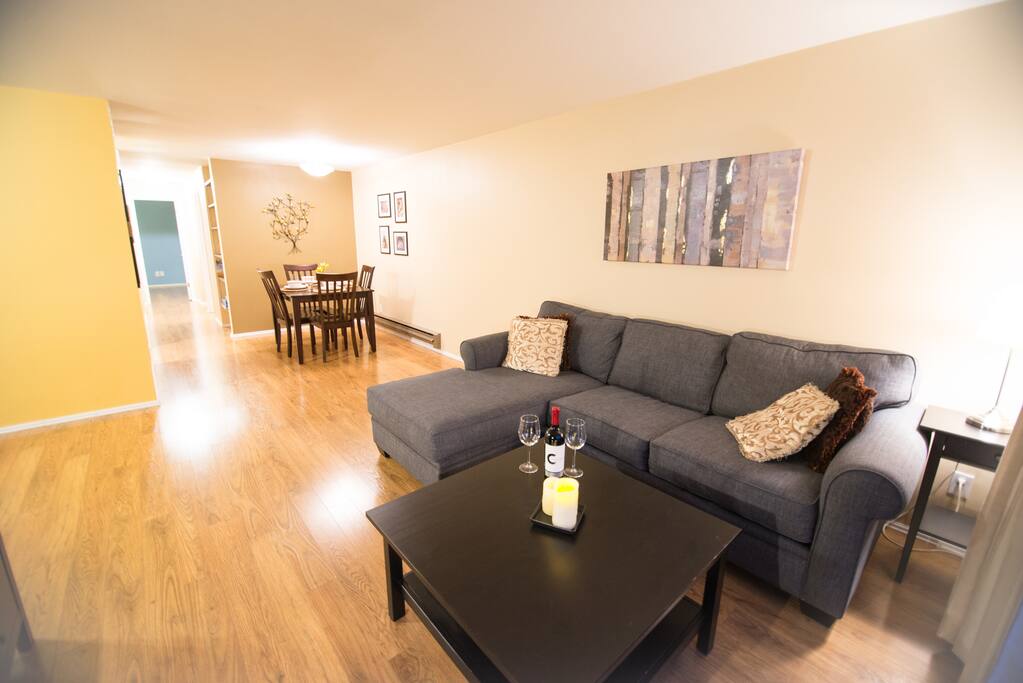 Comfortable couch with chaise and large LCD TV in the living room.