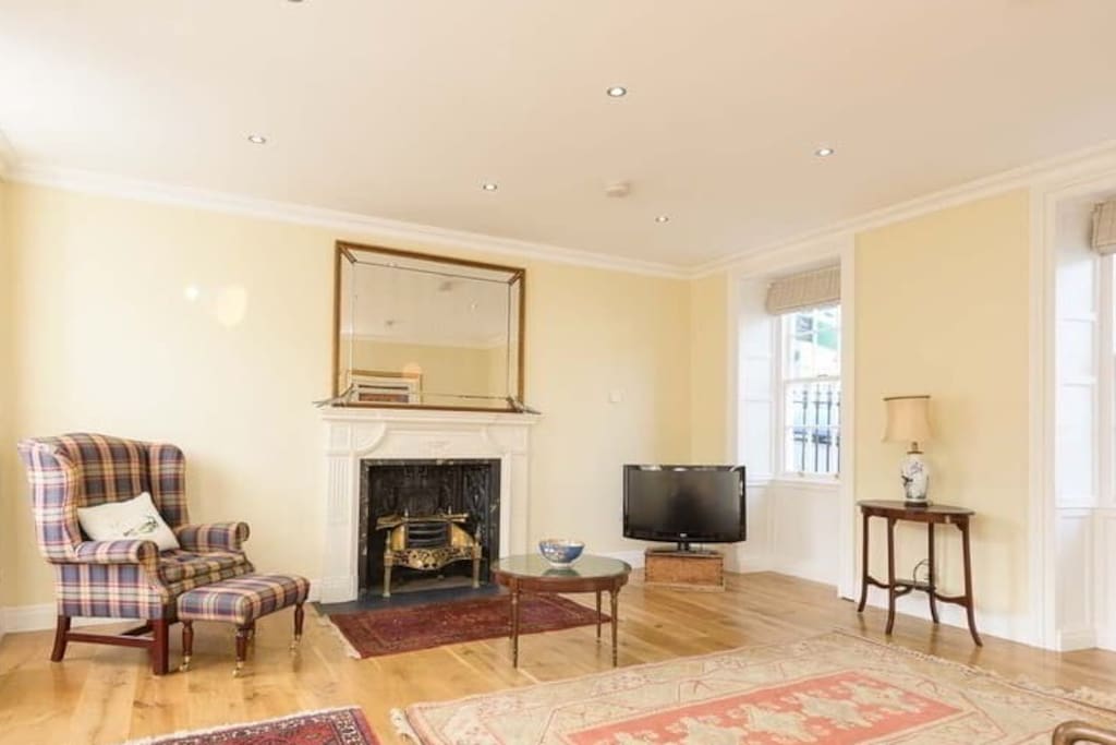 Large comfortable lounge with TV and open fire