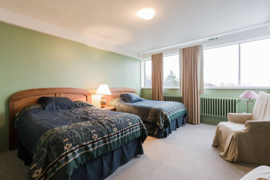 Two comfortable double beds and lounge chairs