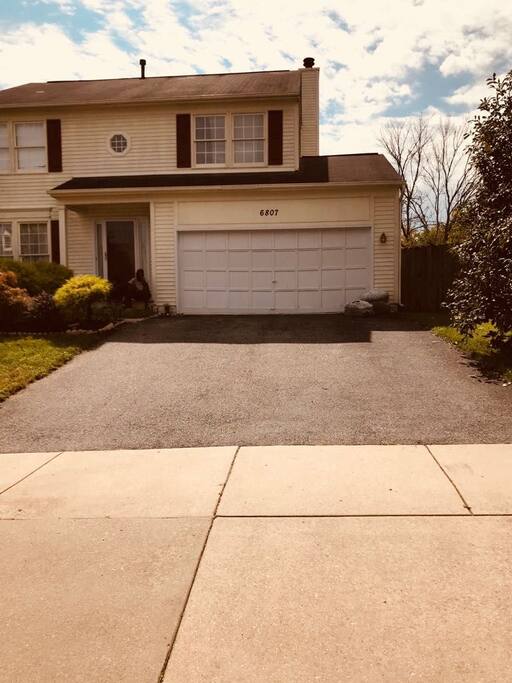 parking in front of the house and at the side of the road