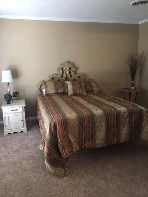 Queen size bed in the front bedroom