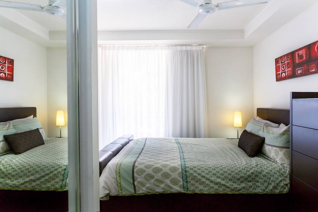 Peaceful bedroom leading on the large balcony