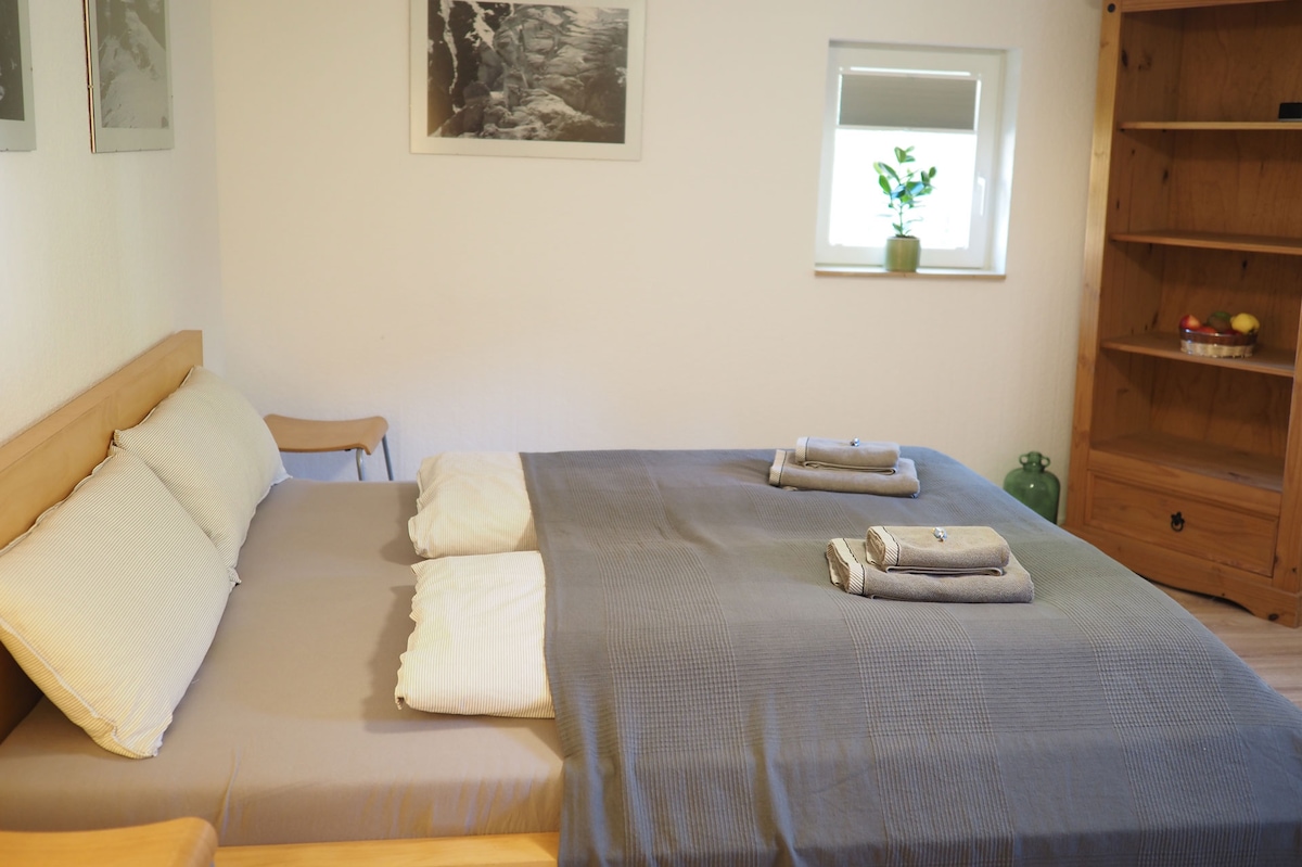 A bedroom with a double bed