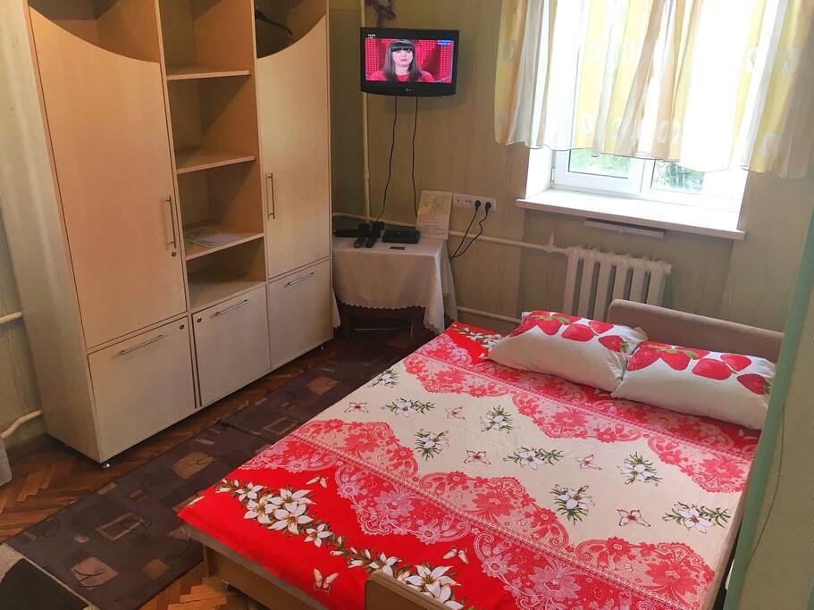 big cupboard + bed + tv