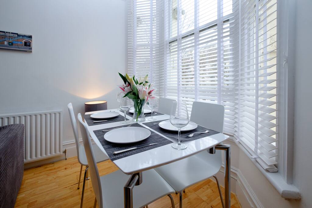 Eat dinner at the dining table in the light & bright lounge that seats 4