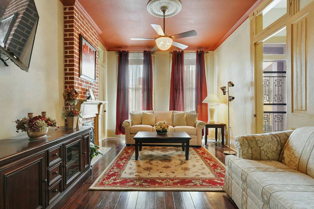 1st living area with sofa sleeper for 2, flat screen tv and seating.