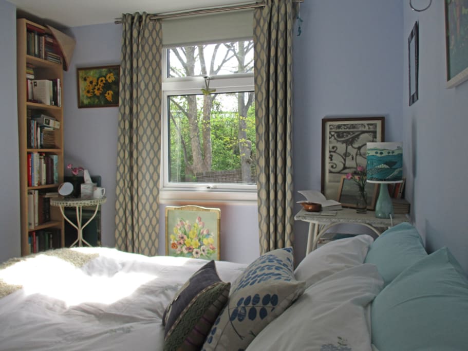 Bright and light bedroom overlooking garden and trees