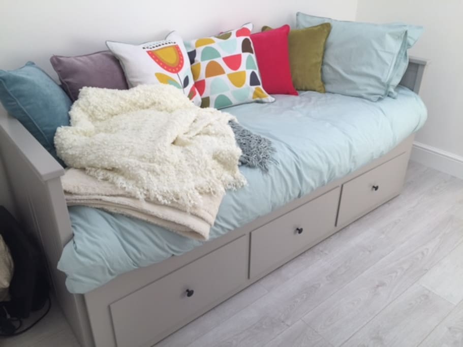 Very comfortable IKEA day bed, pulls out into King Size if preferred