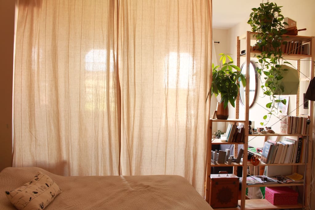 Main bed. In this picture, separated by a curtain from the living room.