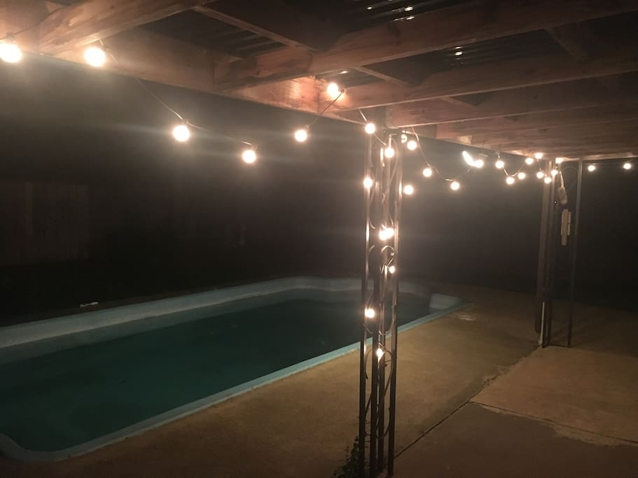 Backyard pool at night