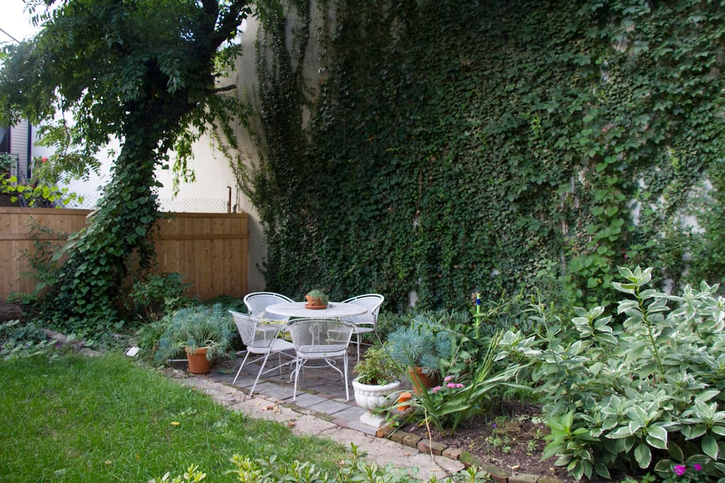 Beautiful private garden with ivy wall. Perfect for enjoying your morning coffee or a glass of wine.