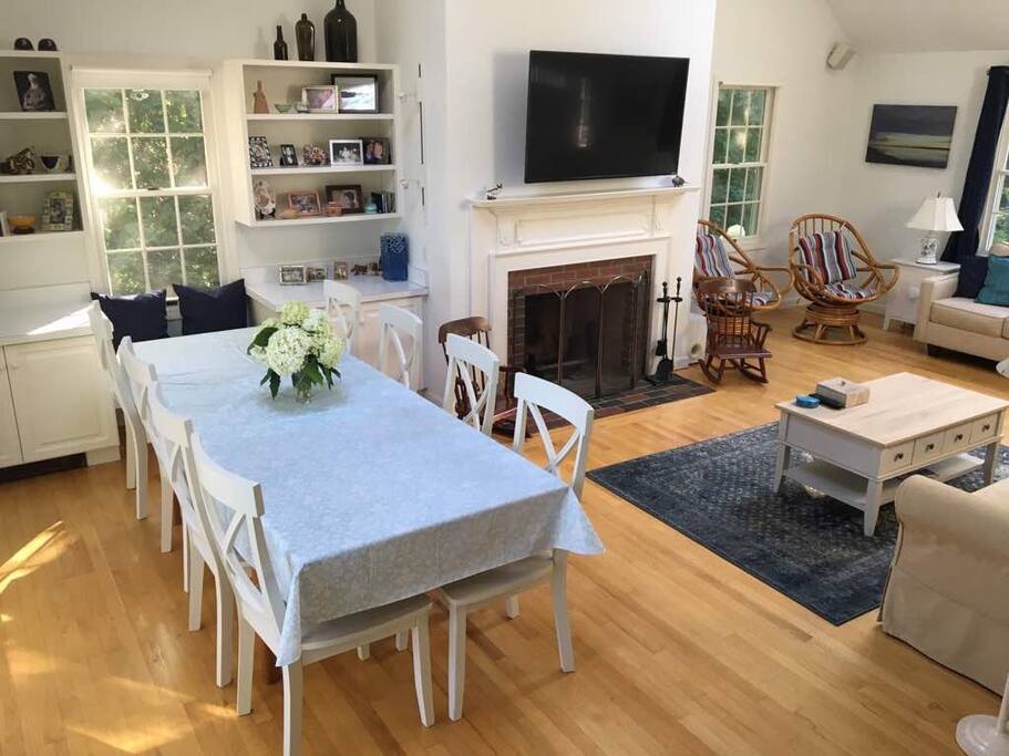 Living room, with dining table, opens on to deck
