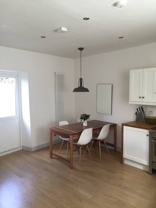 Extendable dinning table for a nice home cooked dinner and a glass of wine.