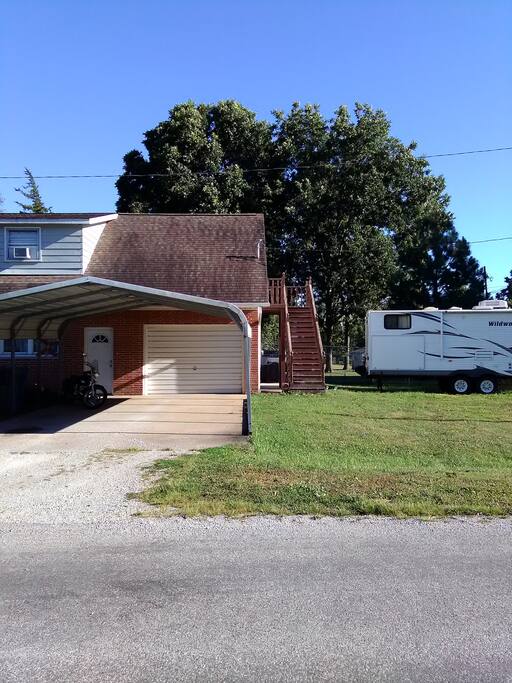 A closer look at the stairs to your private entrance. RV will most likely be gone and you can enjoy the front yard.