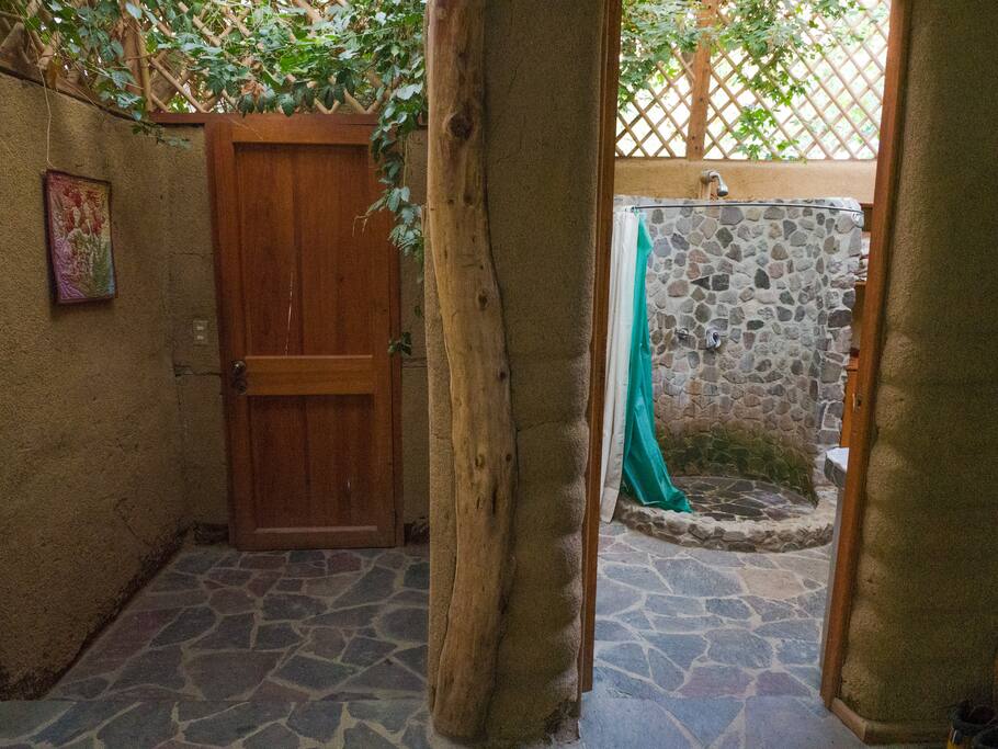 Entrance to bedroom on left and bathroom/shower on right.
