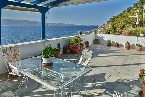 Summer house in Hydra in front of the sea