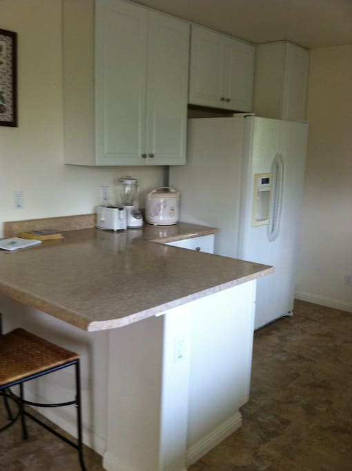 Part of the kitchen with seating at the counter