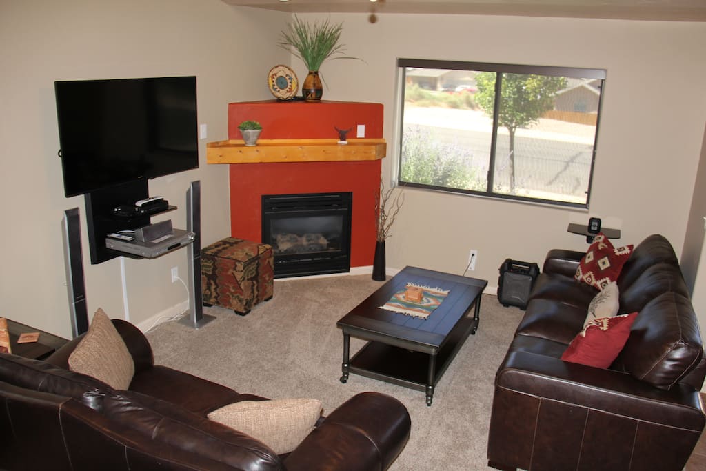 Cozy gas fireplace and flatscreen tv with satellite programming.