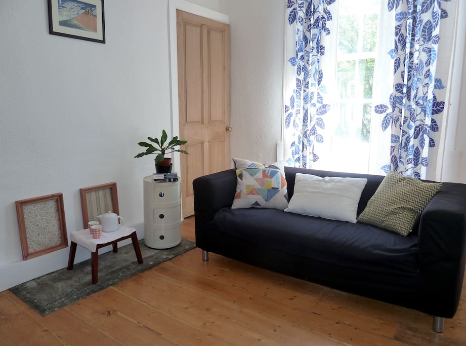 Living room with window overlooking Water of Leith Walkway