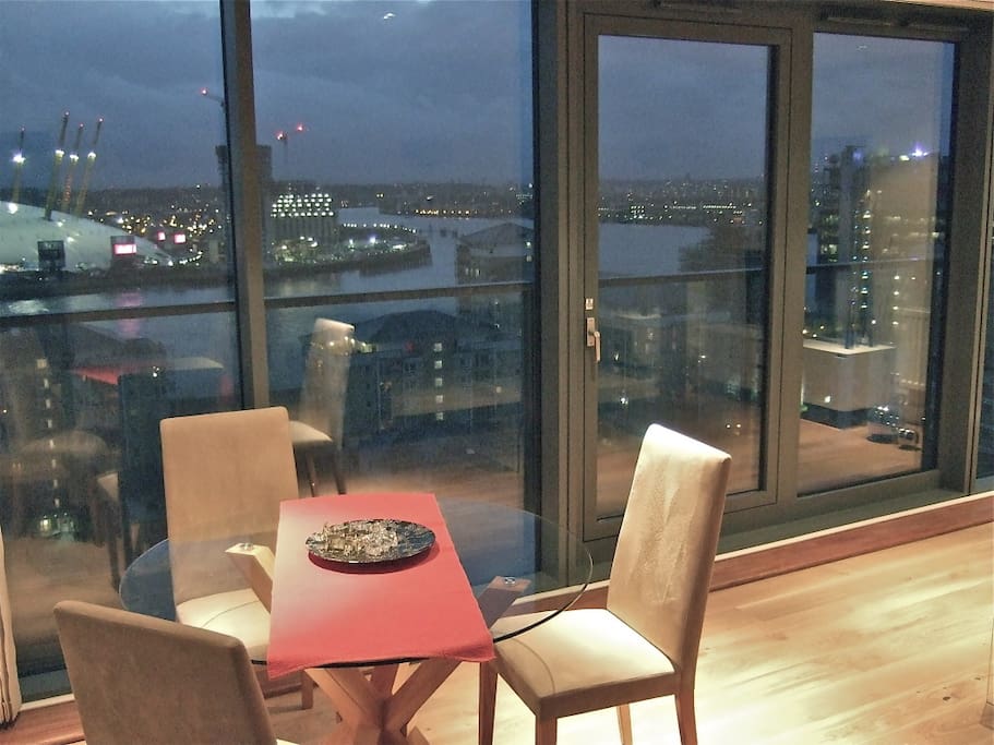 Living room with balcony and views over river Thames