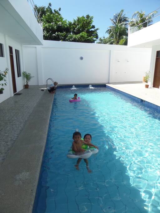 Everyone enjoys the big central swimming pool