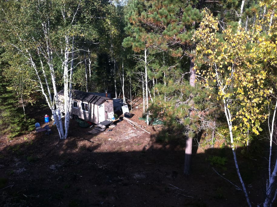 Overlooking the trailer and property on top of the rock.