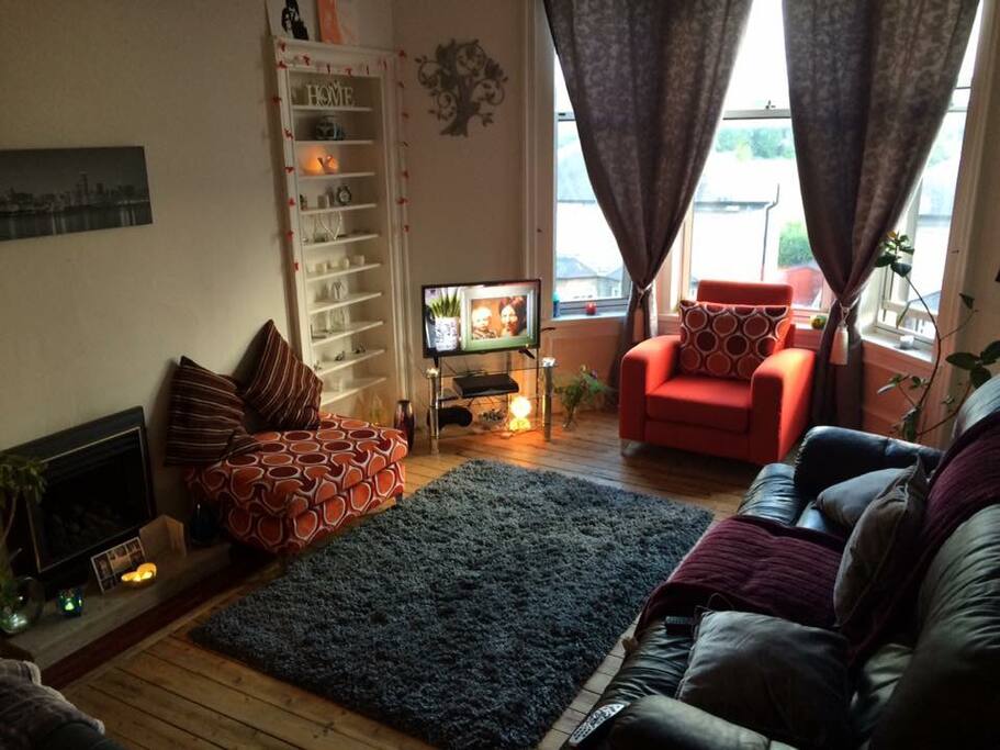 Large comfortable living room with gorgeous views of the city