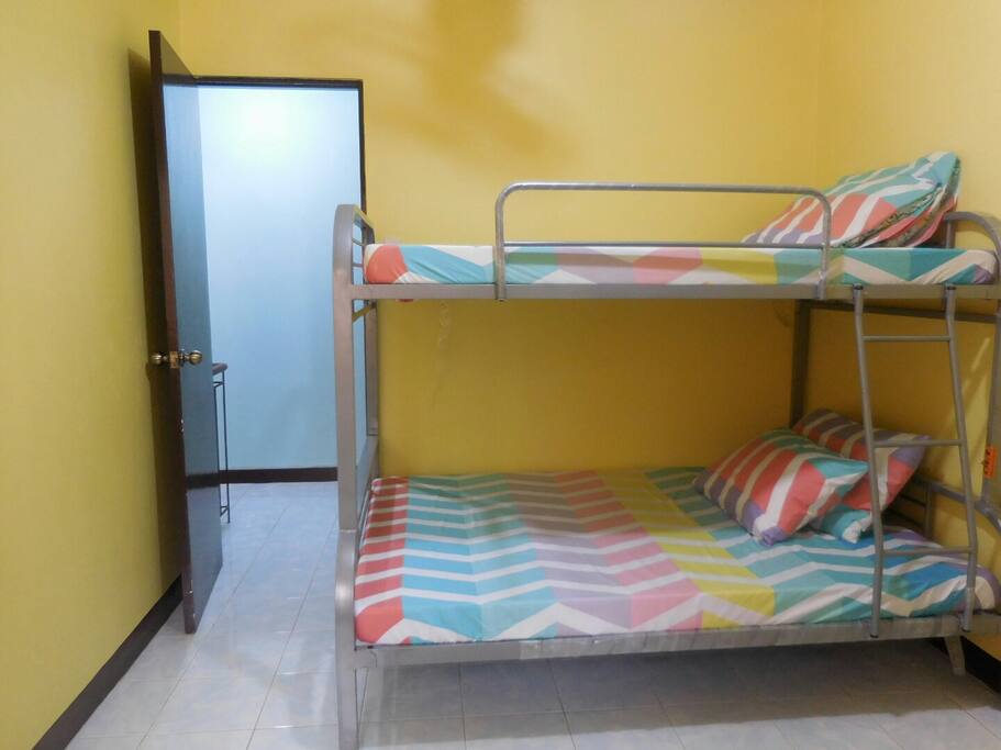 Bedroom 1. Double/ Bunk Bed with smooth and clean linens. Room can fit more than 5 persons.