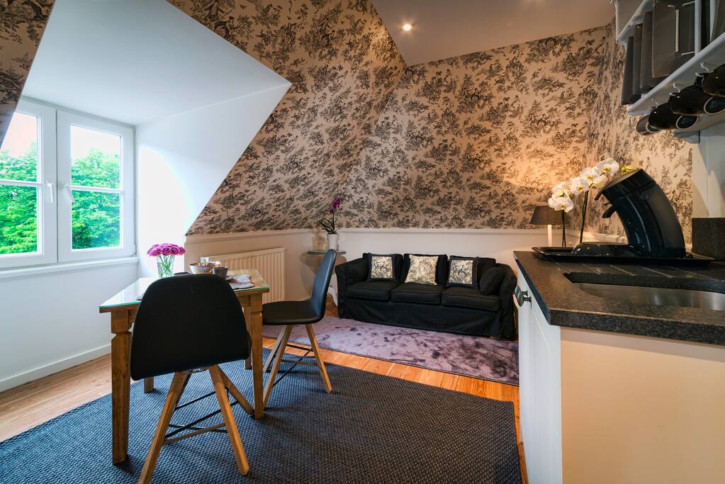 The comfortable sitting-room is equipped with kitchenette facilities, such as coffee machine, refrigerator, micro oven.