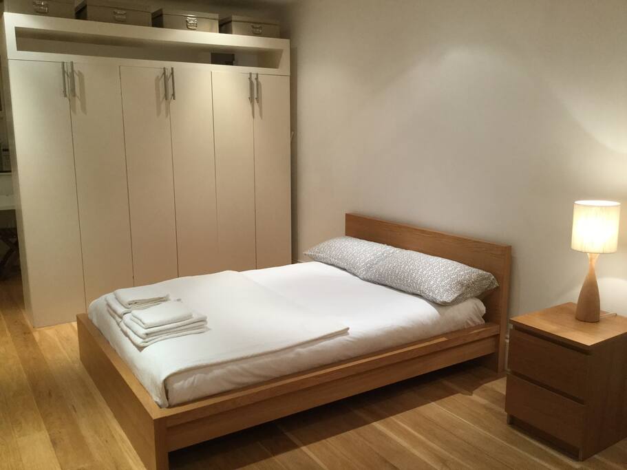 Queen size new mattress with comfortable feather down pillows and duvet
