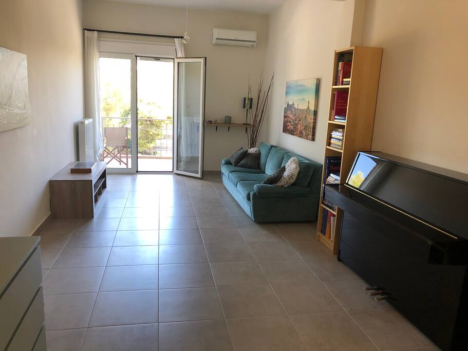 Large living room with balcony beyond