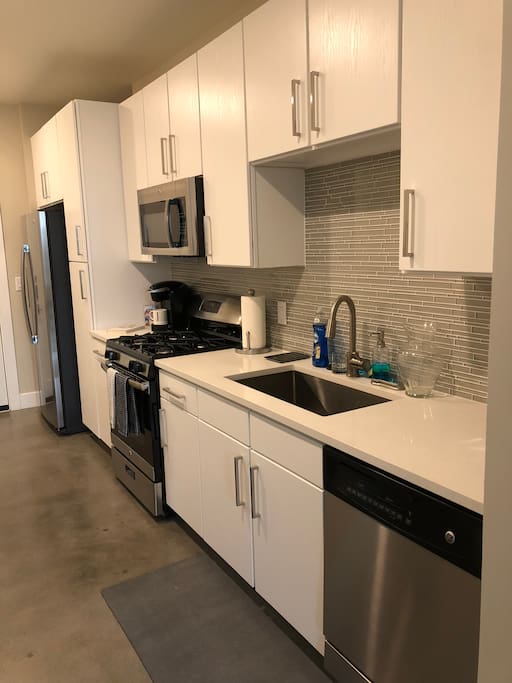 Kitchen with stainless steel appliances, Keurig, toaster, and essentials